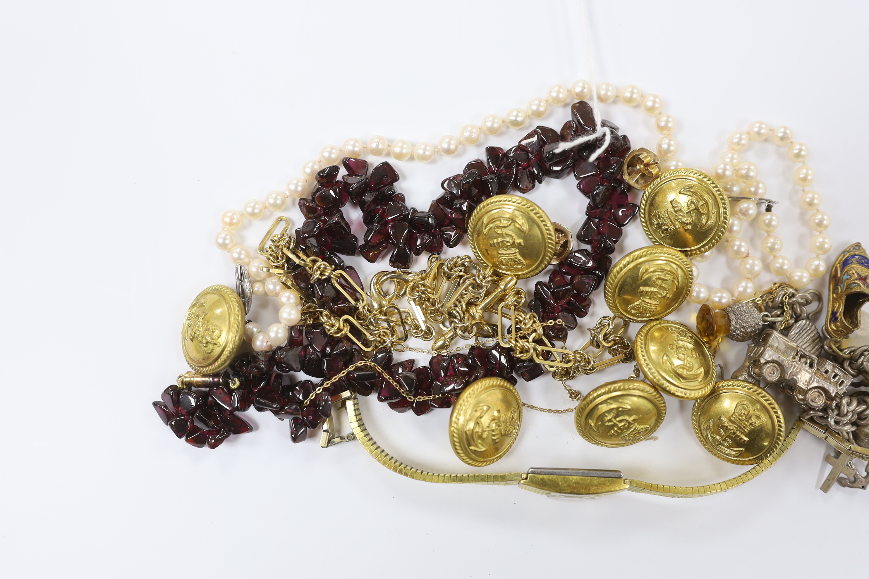 A single strand garnet pebble necklace, with barrel clasp, 38cm, eight military buttons, a lady's steel and gold plated Rotary wrist watch, a pair of 9ct knot ear studs, a yellow metal cross pendant on a 750 chain, a whi